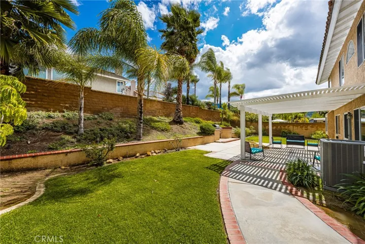 Gorgeous backyard area with pergola and BBQ area.