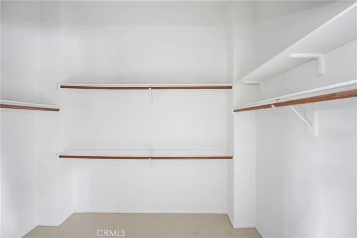 Primary bedroom walk-in closet.
