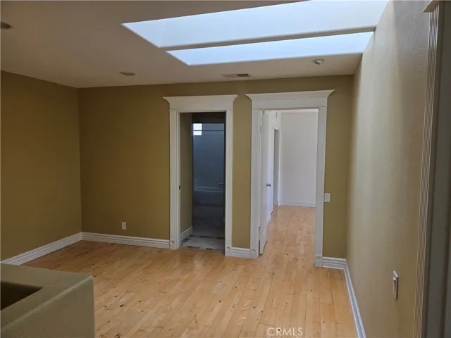 ADDED LOFT W/ WOOD FLOORING,   LARGE BASEBOARDS AND ADDED SKYLIGHTS