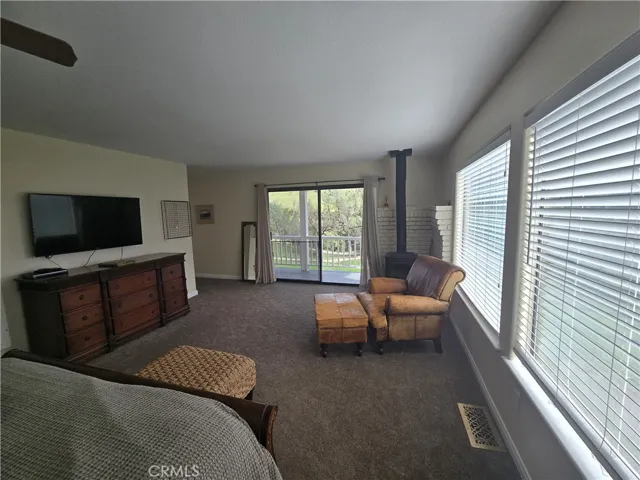 Primary bedroom, with woodstove