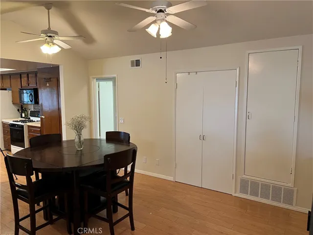 Large dining room with double door storage pantry