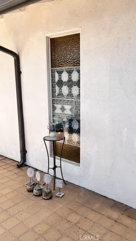 Privacy textured glass window (atrium side; garage area)