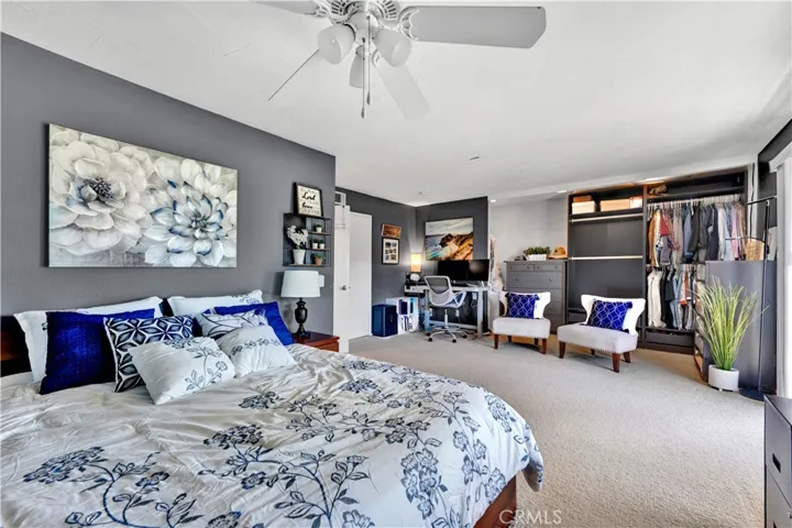 Upstairs, the impressive primary suite offers a full retreat area