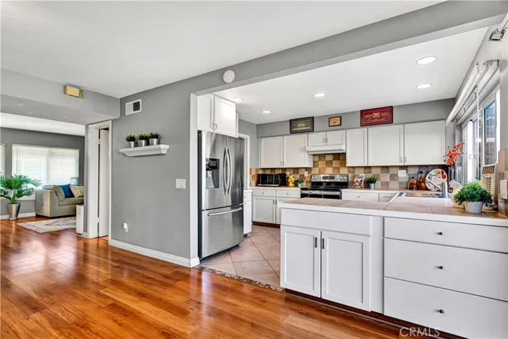 an added peninsula with extra cabinetry and counter space