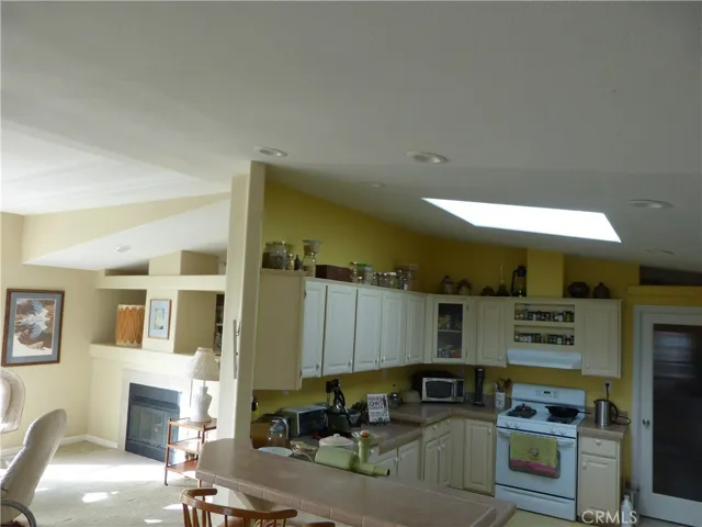 Dining area into kitchen showing the bar