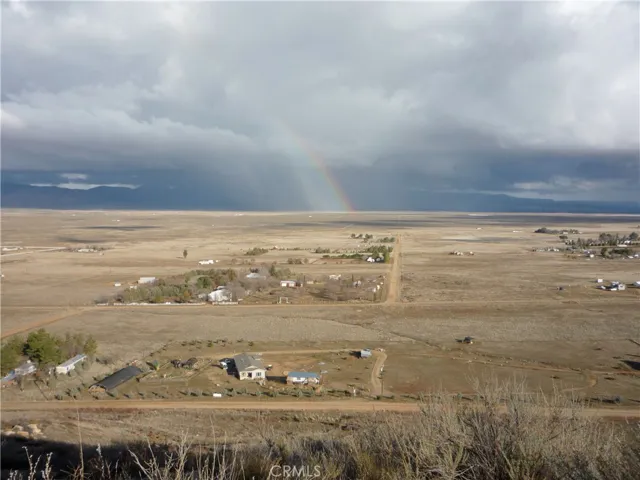 Looking down to the home from the top of the neighboring hill - photo from several years ago