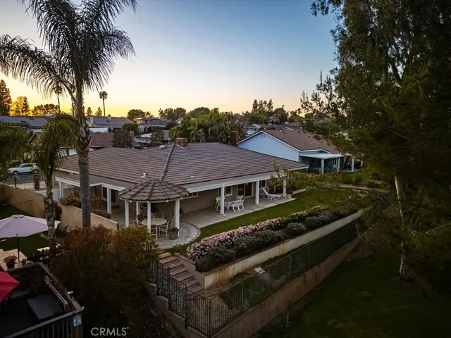Drone view of backyard and house