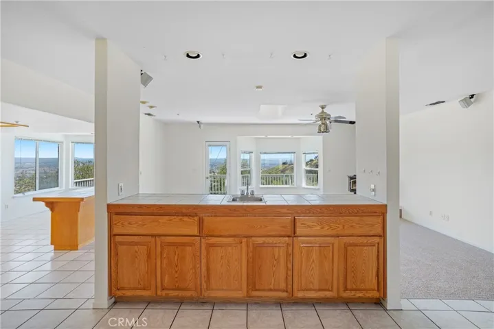 Wet bar between formal dining room & great room