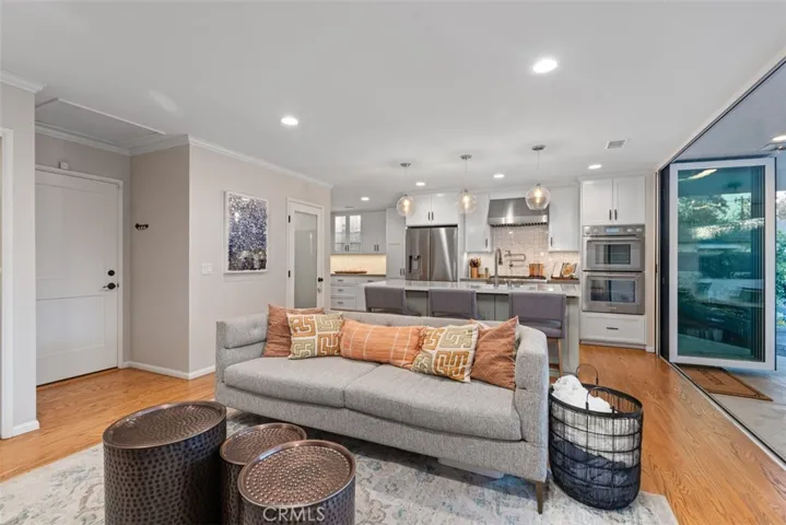 Open concept kitchen, living room and panoramic doors that make entertaining idyllic.