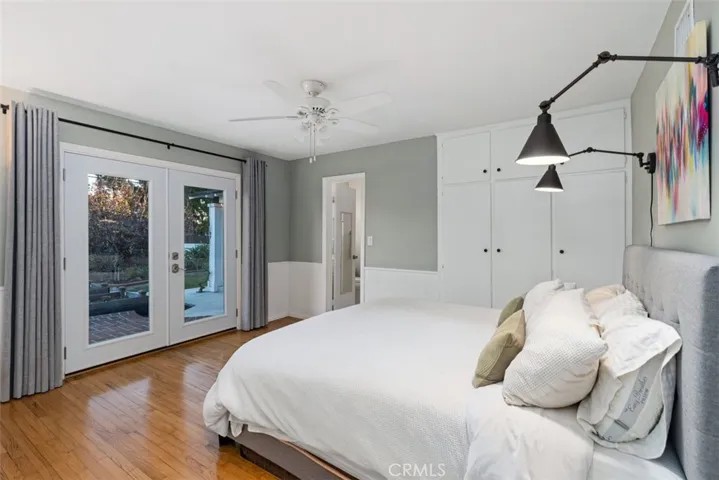 Primary Bedroom with attached bathroom and French doors that open out to the garden