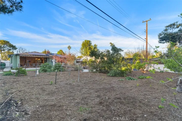 Large lot with 35 fruit trees and a shed with concrete base