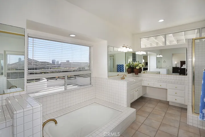 Primary bedroom tub and vanity