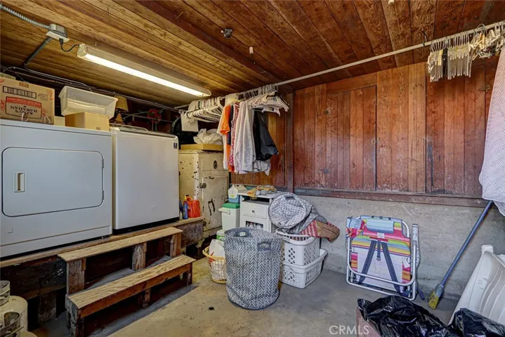 Downstairs laundry room or "summer kitchen" with shelves for preserves!