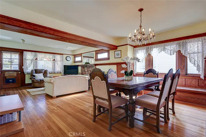 Gleaming hardwood floors and a built in window seat, leaded glass detail on dining room windows.