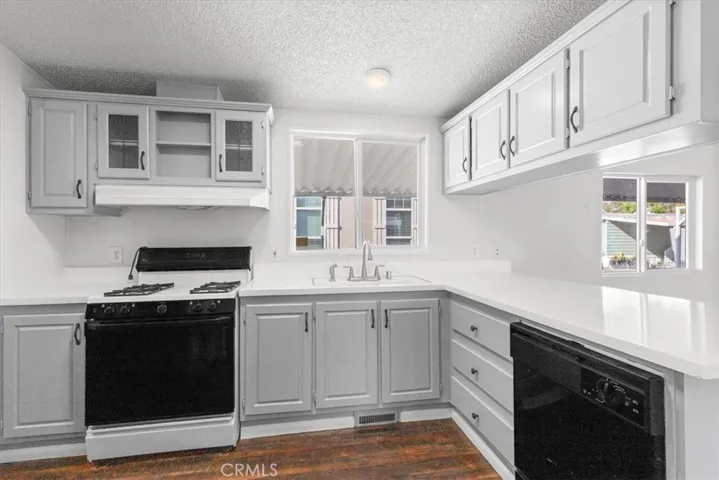 Kitchen, New counters and cabinets freshly touched up & painted with new handles. Comes with refrigerator, washer, dryer