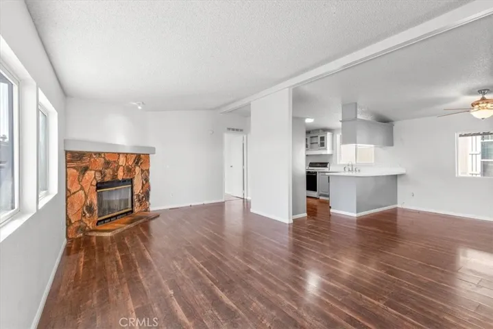 Kitchen and living area Fireplace new ceiling fans