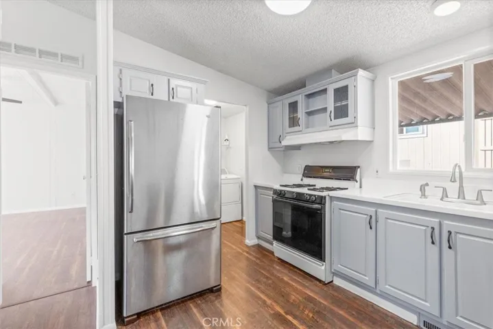 Kitchen area comes with refrigerator, oven, dishwasher