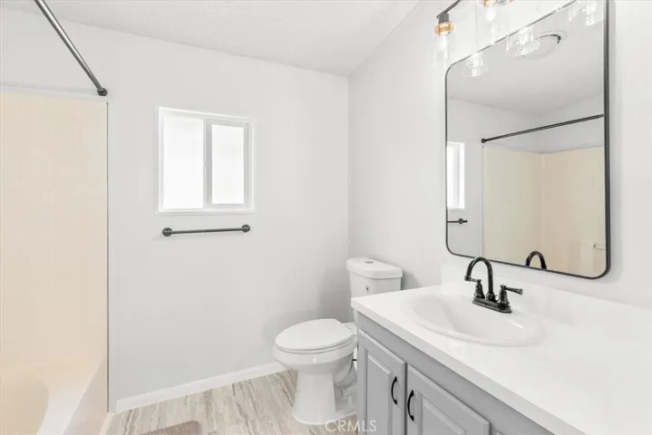 Master bathroom-new flooring separate tub and shower & new counter tops, faucet, mirror, lights