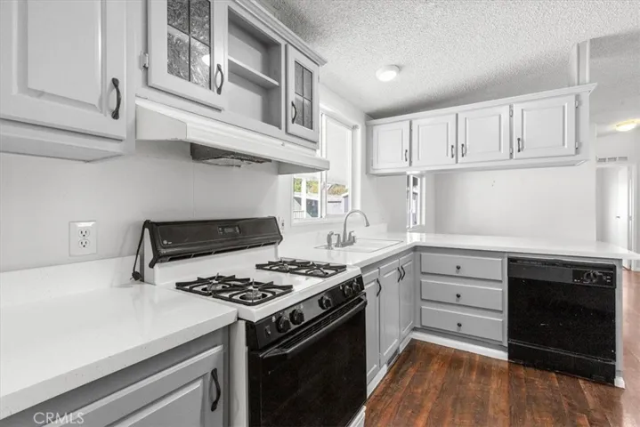 Kitchen, New counters and cabinets freshly touched up & painted with new handles. Comes with refrigerator, washer, dryer