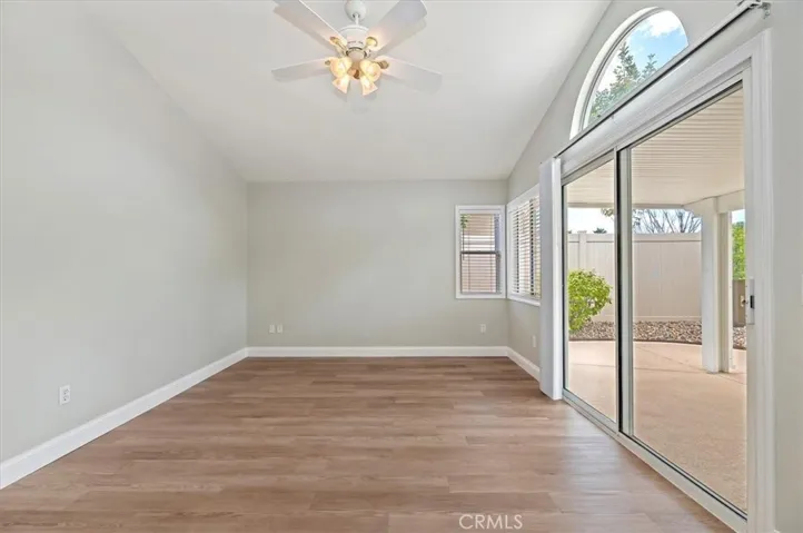 Primary bedroom opens to the rear yard patio