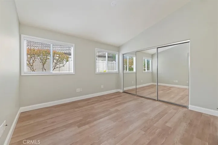Guest bedroom with mirrored wardrobe doors