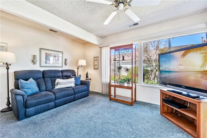 Sun-filled family room with amazing views of the lush backyard gardens