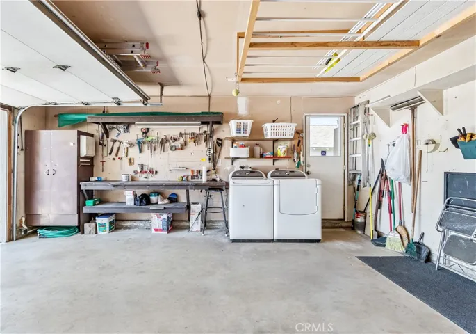 Garage with washer & dryer, work bench and loads of storage!