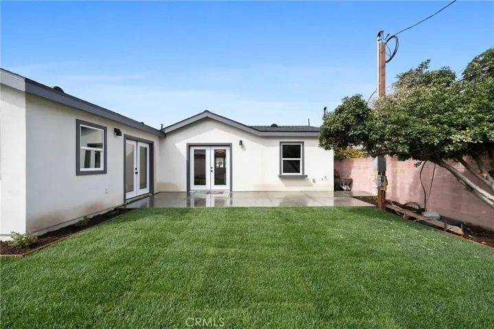 Backyard facing Family Room & Primary Suite doors