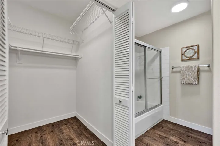Walk-in closet in primary bathroom
