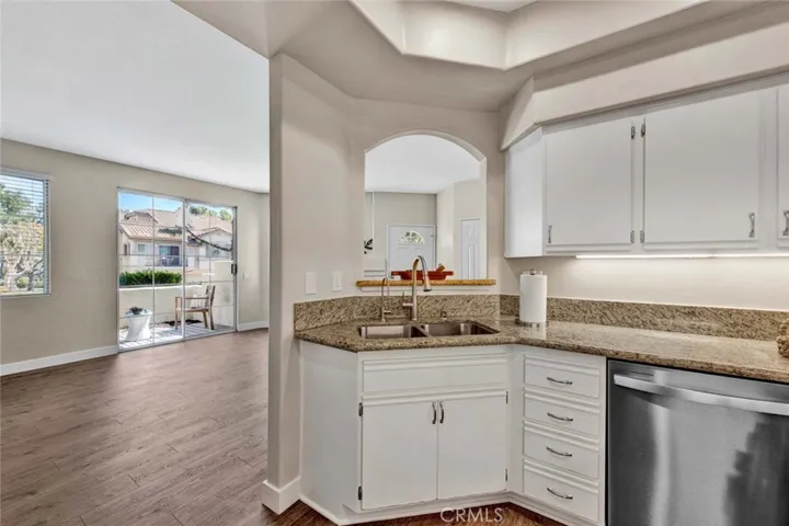 Granite countertops in kitchen with new stainless steel appliances