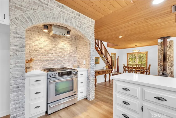 Lime washed brick surround and quartz counter tops