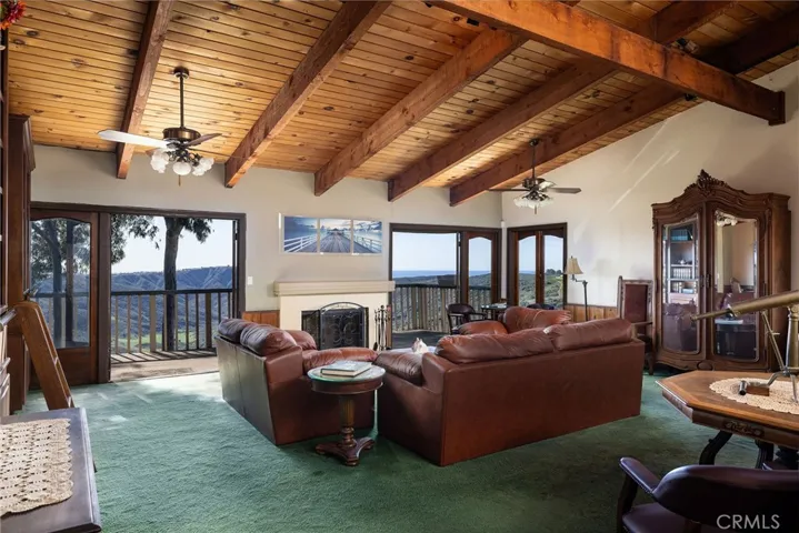 Generous living room with French doors open onto expansive south-facing balconies positioned to maximize your enjoyment of this exceptional location.