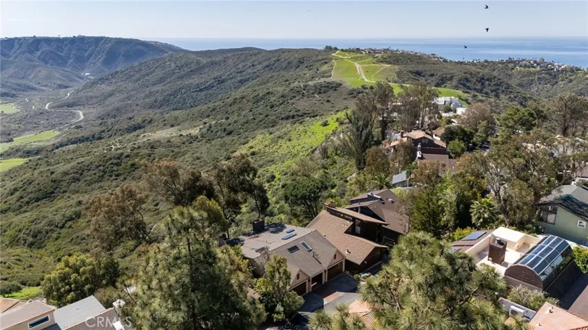 Enjoy privacy and forever views, nestled on a private road and backing to protected land.