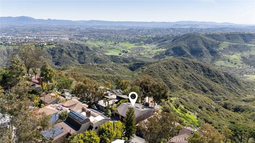 Enjoy privacy and forever views, nestled on a private road and backing to protected land.