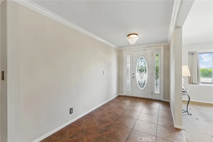 Add a door off of the entryway and convert 3rd Car bay of garage to 5th bedroom