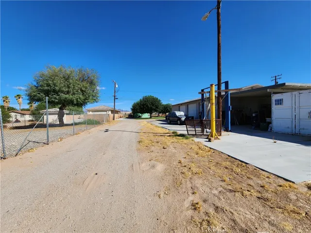 Long driveway facing toward shop and main house