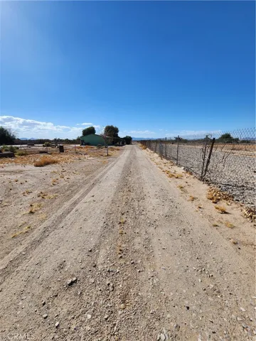 Long driveway facing toward guest house and street