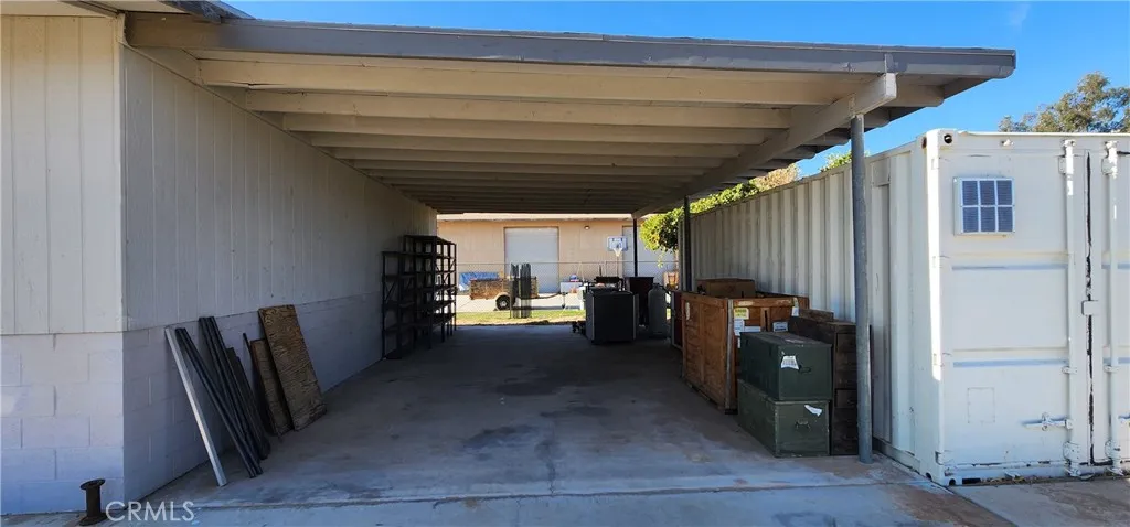 Covered carport off of garage/shop