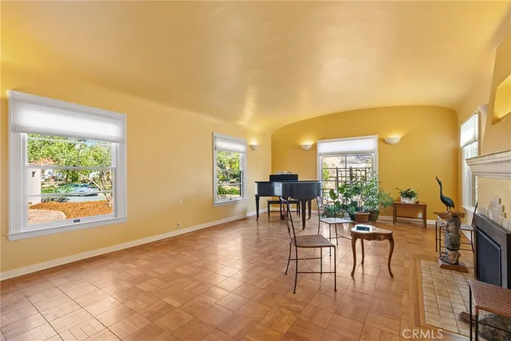 Formal Living Room: beautiful over-sized windows, floor and window mouldings, new insulated shades.

