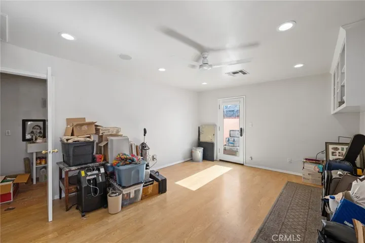 South (3rd) Bedroom: giant-sized, laminate wood flooring, large walk-in closet currently used as a darkroom with a sink-could be easily converted into a 3rd full bathroom, built-in shelves, door to side yard for possible ADU-AirBNB-home business office uses, new ceiling fan, recessed dimmable ceiling can lights.

