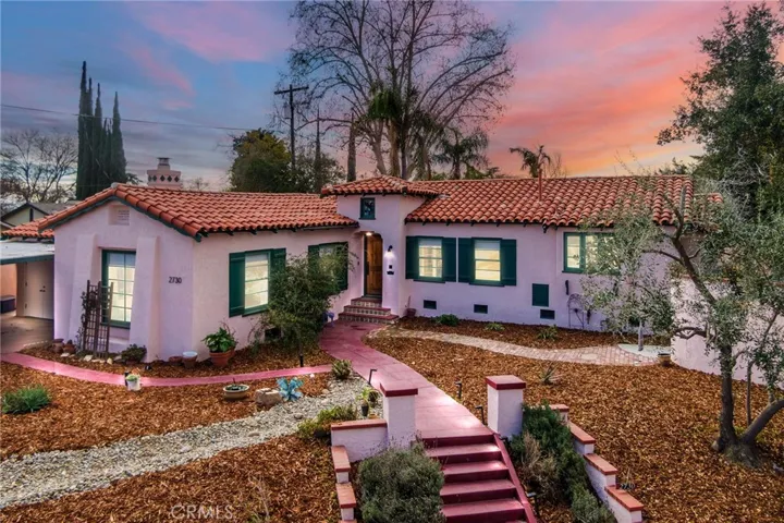 Front Exterior Elevation: A romantic Upper La Cresta charmer, Mission style architecture, real fireplace, Spanish tile roof, textured stucco exterior, shutters, new low maintenance xeriscaped landscaping and full drip irrigation system, house elevated from the street for privacy, entire exterior and all stuccoed walls are freshly painted.