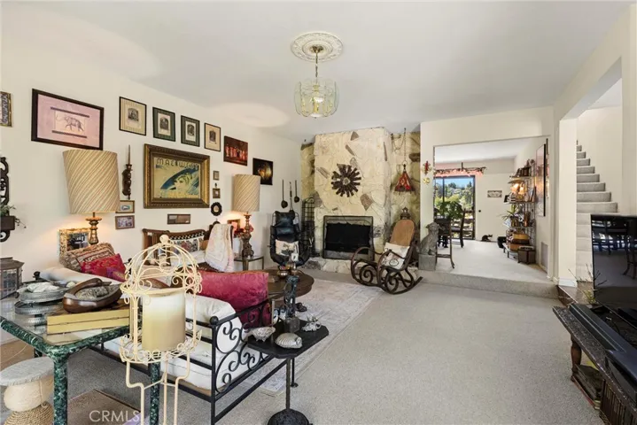Living room with fireplace looking towards Den