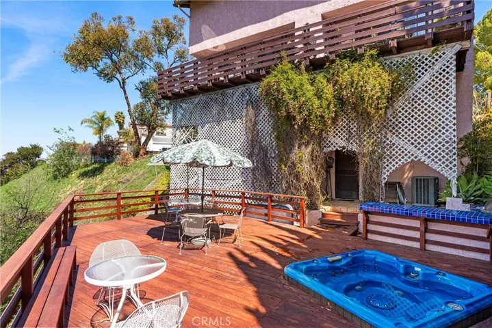 Main deck with BBQ area and spa