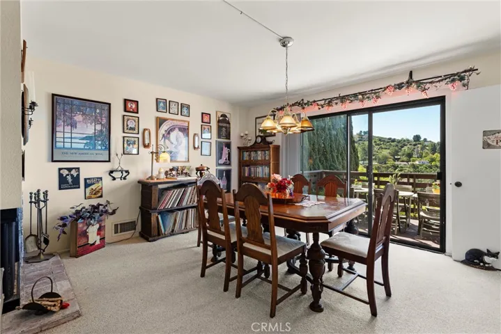 Den with fireplace  currently used as another dining area