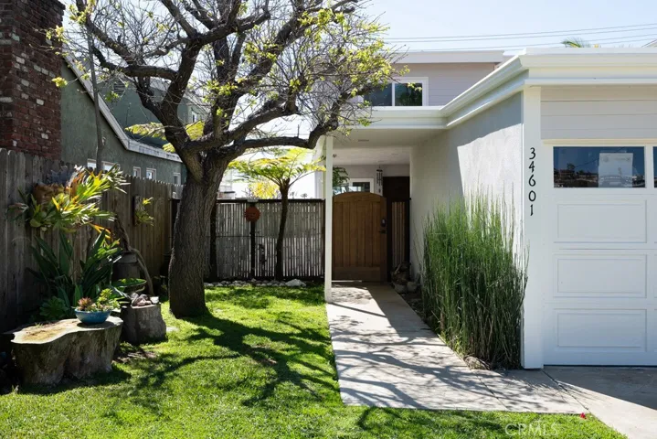 Gated front entry leading to a private courtyard.