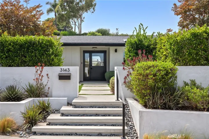 Set on an expansive 10,800 sq. ft. lot, this approximately 2,057 sq. ft. home has been meticulously redesigned to blend timeless sophistication with coastal modern design.