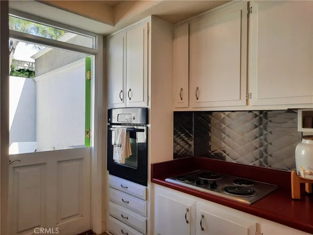 Kithen w/ dutch door leading to the patio