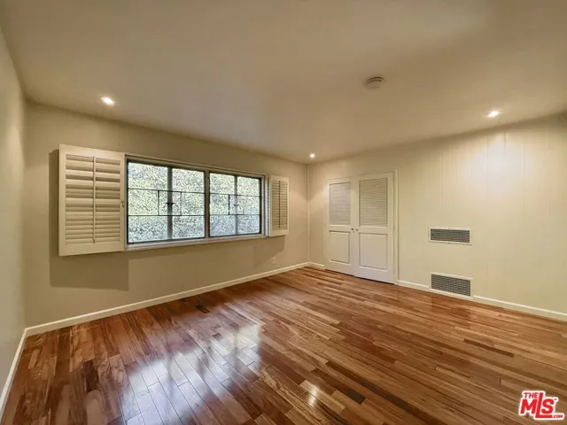 Two closets and tree-top views
