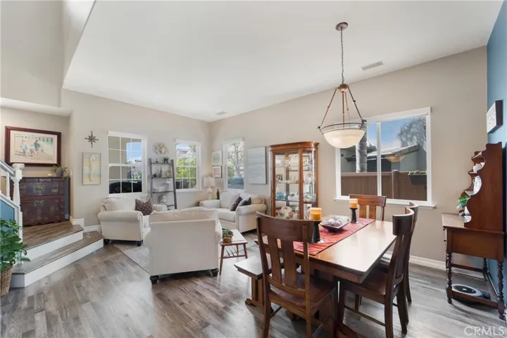 Formal living and dining rooms are graced with custom built ins.
