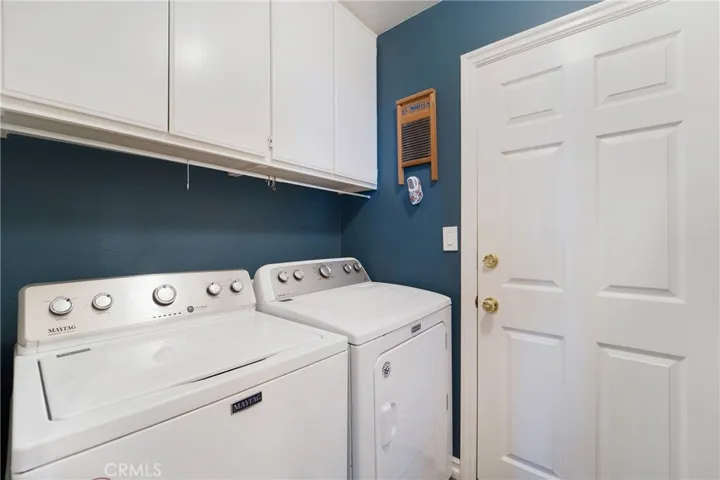Downstairs laundry room compliments the full bed and bath.